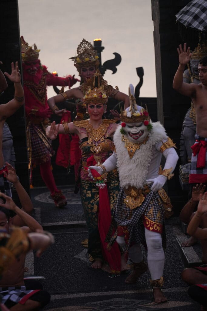 Traditional Kecak Dance performers in colorful costumes at Uluwatu Temple, a must-see cultural highlight on a Bali Trip