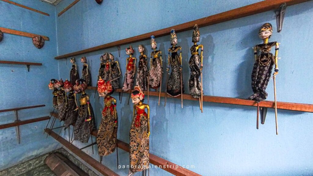 Traditional Javanese wayang puppets displayed inside a cultural space in Yogyakarta, reflecting the history of Yogyakarta through classical art, storytelling, and royal heritage.