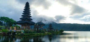 Ulun Danu Beratan Temple on Lake Beratan, one of the best temples to visit in Bali, surrounded by misty mountains and calm water reflections.