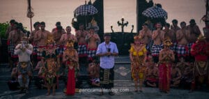 Traditional Balinese dancers performing a cultural ritual at a temple in Bali during a religious ceremony