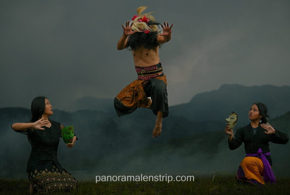Traditional masked dancer performing ritual dance.