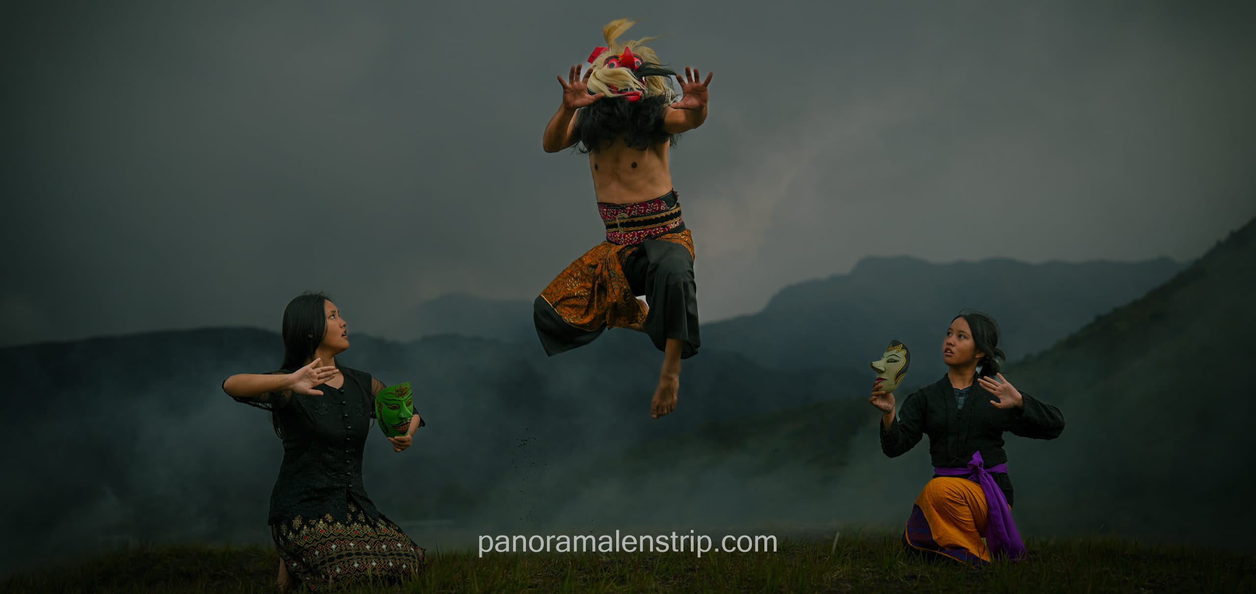 Traditional masked dancer performing ritual dance.