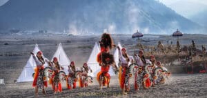 Traditional dancers performing during the Yadnya Kasada Bromo festival at Mount Bromo, East Java, Indonesia
