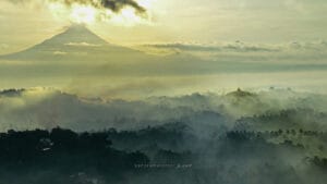 facts about Borobudur Temple with sunrise view over Mount Merapi and misty Central Java landscape