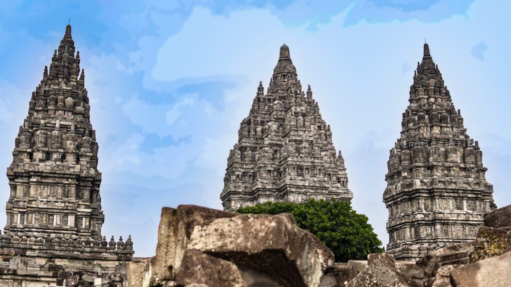 Prambanan photography guide view of three towering temple spires framed by volcanic stone foreground at Prambanan Temple Yogyakarta