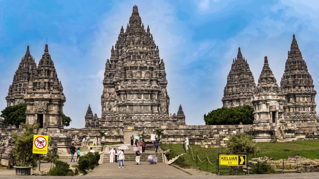 Prambanan photography guide showcasing symmetrical Hindu temple spires at Prambanan Temple in Yogyakarta under clear blue sky