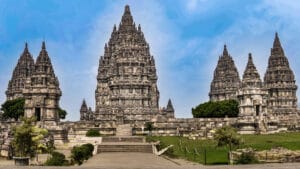 Prambanan photography guide showcasing symmetrical Hindu temple spires at Prambanan Temple in Yogyakarta under clear blue sky