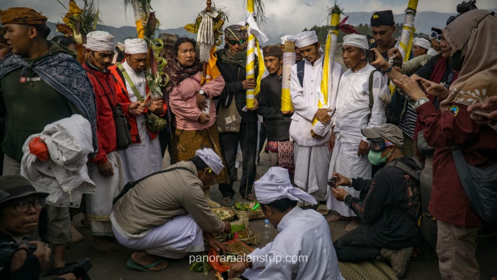 Tenggerese locals and priests preparing traditional Hindu offerings on the Mount Bromo caldera during the Yadnya Kasada ceremony.