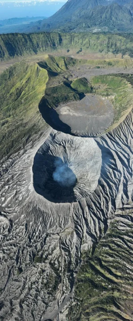 View of Mount Kursi, Bromo crater on the left, and Segoro Wedi during an exclusive Mount Bromo trekking route