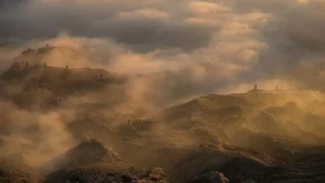 Cinematic atmospheric light and dust at Pasir Berbisik during an off-road adventure
