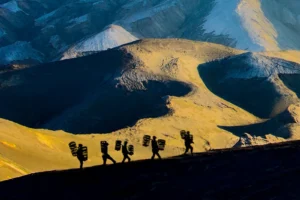The stark, lunar-like environment of the vast ash basin provides a dramatic contrast after an early morning golden hour session.