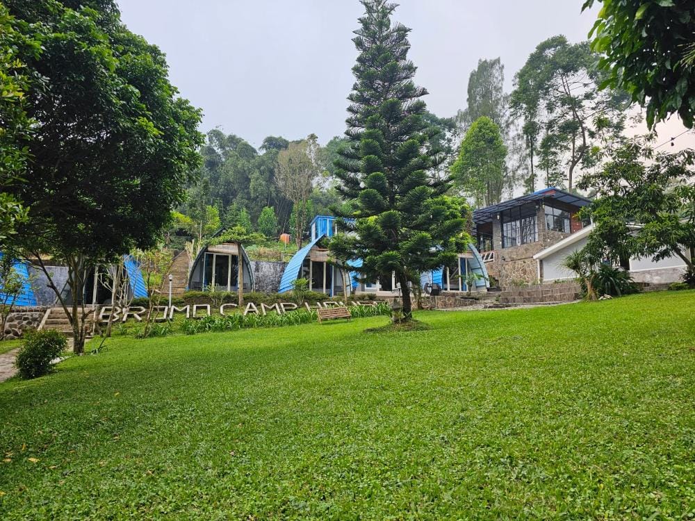 Glamping cabins and landscaped garden at Bromo Camp House in Sapikerep Village near Mount Bromo