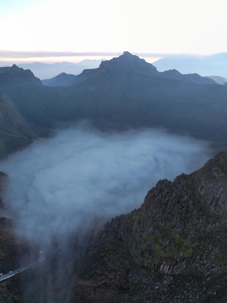 Clouds filling the crater of Kawah Kelud volcano in Indonesia