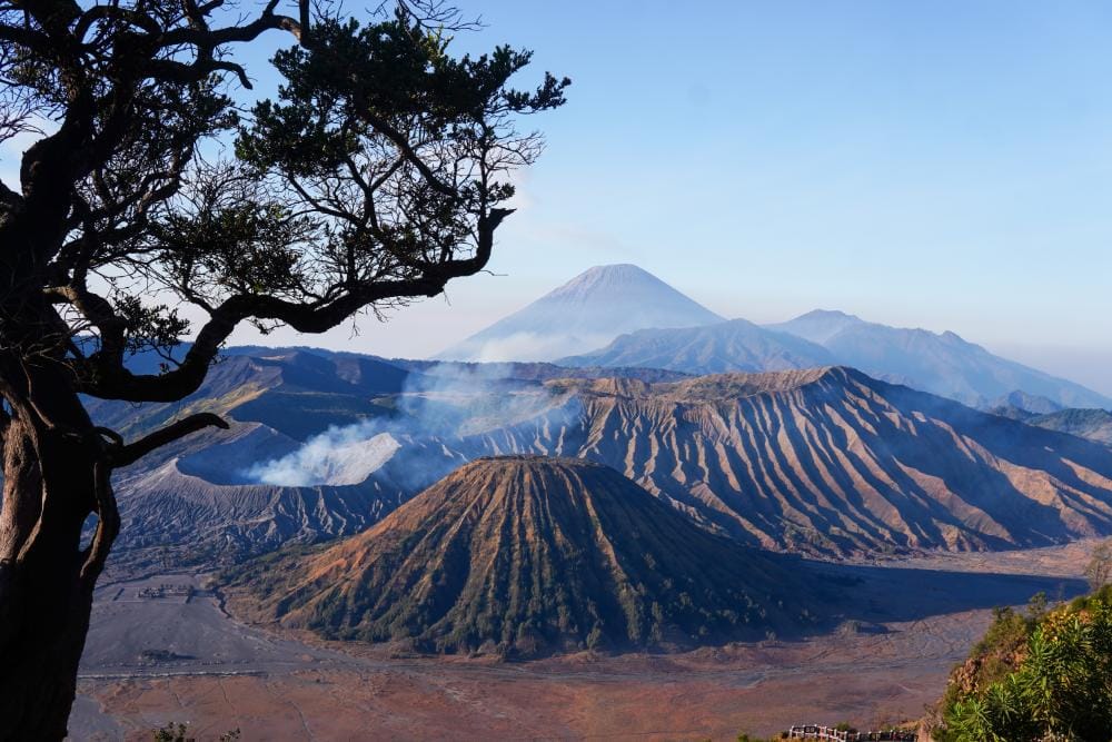 Mount Bromo landscape framed by a Mentigen wooden structure from Penanjakan viewpoint