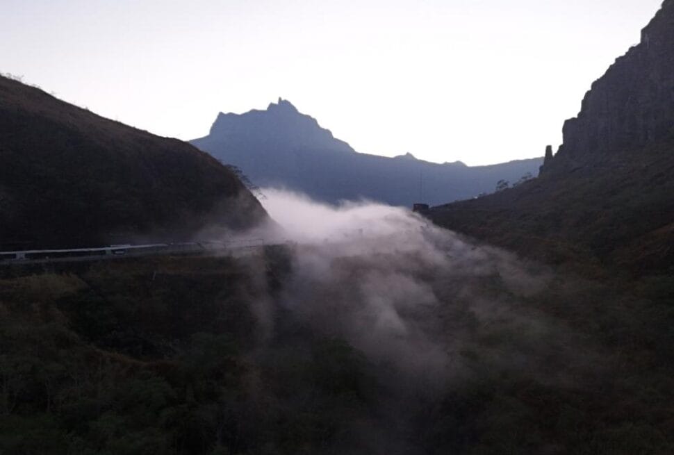Drone view of Mount Kelud landscape before sunrise with mist rising through the valley