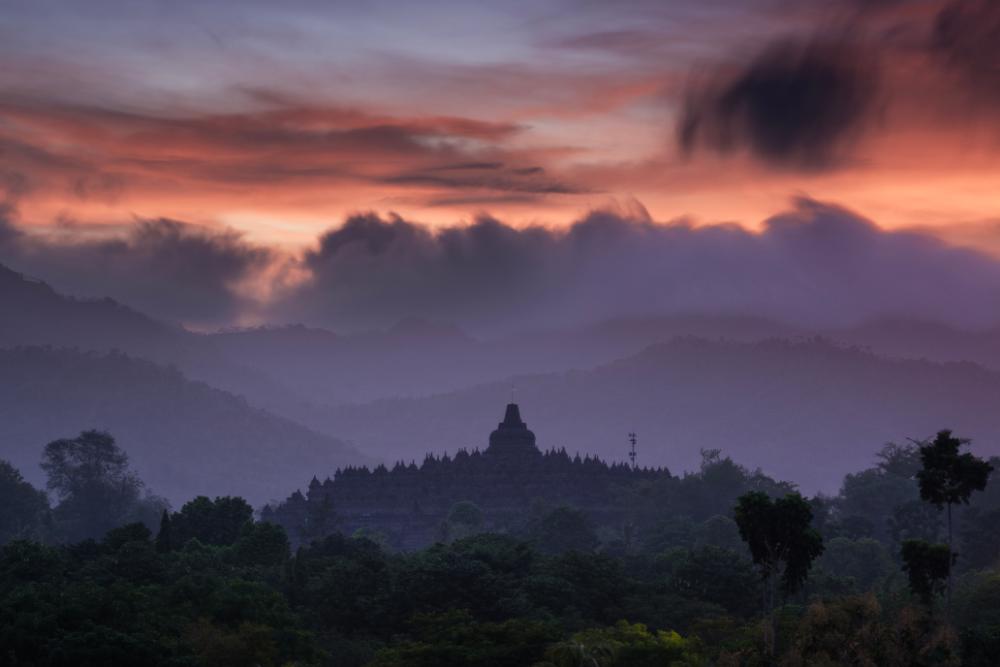 Golden sunrise over Borobudur Temple at Putuk Situmbu before the sun rises above the horizon